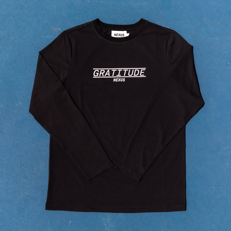 Black long-sleeve shirt with 'GRATITUDE' text on a blue background